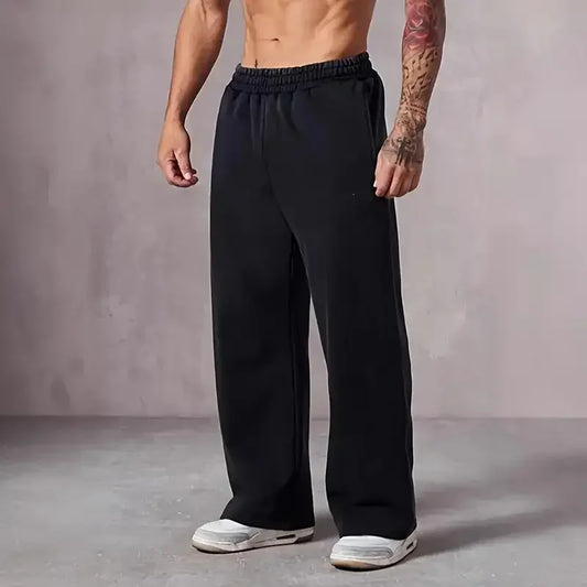 Men's plus size solid color jogging pants for daily fitness wear, elastic waist loose straight leg casual pants