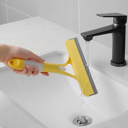 A household glass cleaning scraper that combines the functions of a watering can and a window scraper.